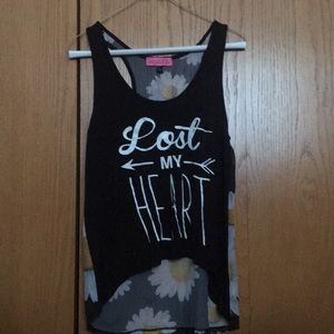 Black tank top with white words on the front